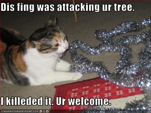 CatkillsX-mastreetinsle.jpg Cat kills Christmas tree tinsil image by NakeBenihime